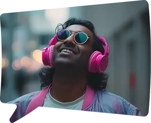 A man in pink headphones and mirrored sunglasses grins up at the sky